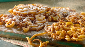 A combination of fried dough and sprinkled with cinnamon and sugar.  